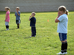 Kids doing soccer drills at practice